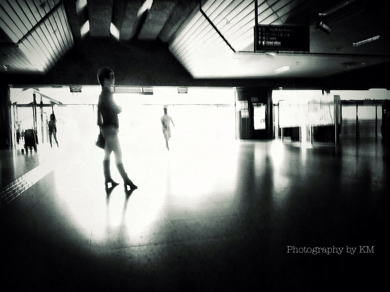 indoors, men, illuminated, airport, built structure, silhouette, walking, full length, lifestyles, person, flooring, architecture, ceiling, modern, transportation, city life, tiled floor, shadow