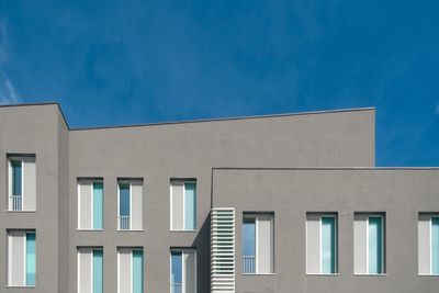 Low angle view of building against blue sky