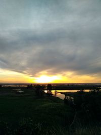 Scenic view of sunset over lake