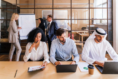 Business colleagues working in office