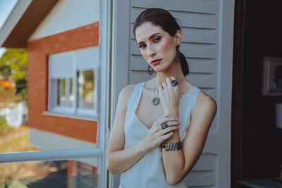 Portrait of woman standing at home
