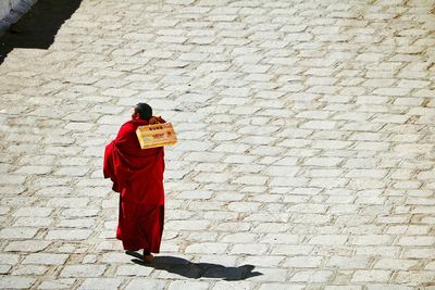 High angle view of monk walking on street