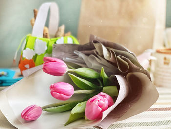 Close-up of pink roses on table