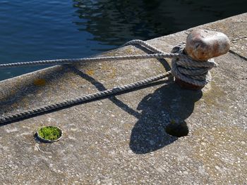 High angle view of rope tied on boat