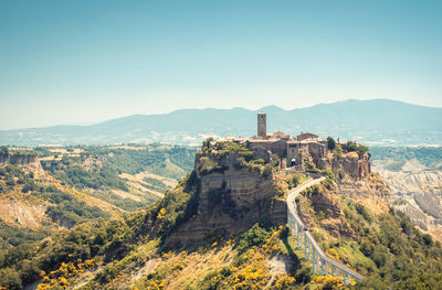 Civita di bagnoregio, an antique town in the countryside of central italy, perched on top of a hill