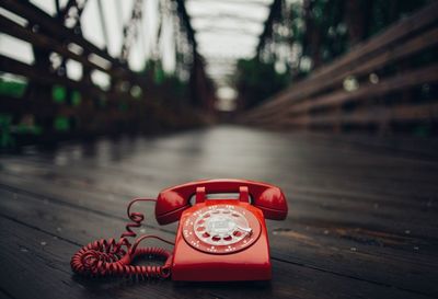 Close-up of telephone on footbridge