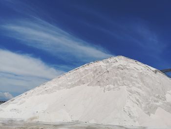 Scenic view of snowcapped mountain against blue sky