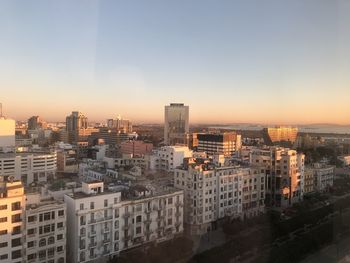 High angle view of buildings against sky during sunset