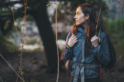 Young woman looking away outdoors