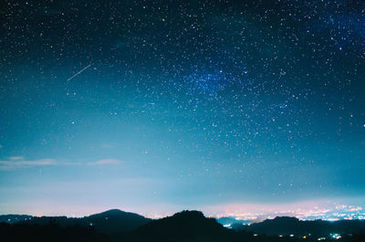 Scenic view of star field against sky at night