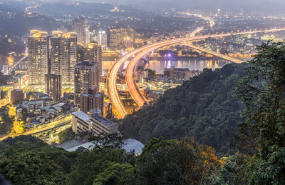 High angle view of illuminated buildings in city