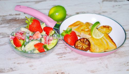 Close-up of fruits in bowl on table