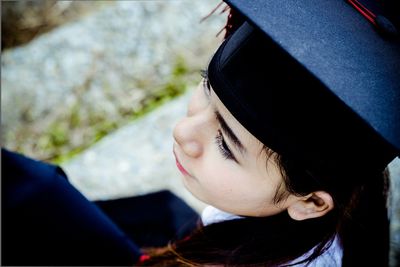 High angle view of woman wearing graduation gown