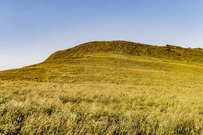 Scenic view of land against clear sky