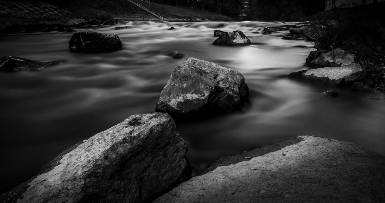 STREAM FLOWING BY ROCKS