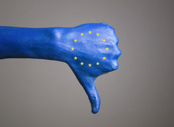 Close-up of man against blue background