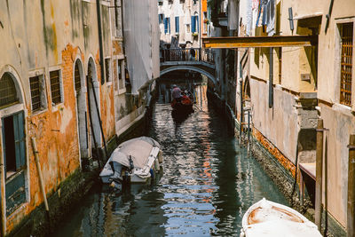 High angle view of canal amidst buildings in city