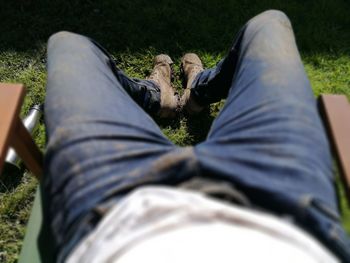 Low section of man lying on grass