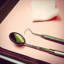 Close-up of dental equipment on table