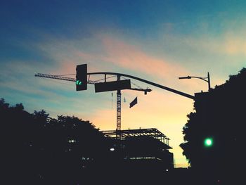 Low angle view of building against sky at sunset