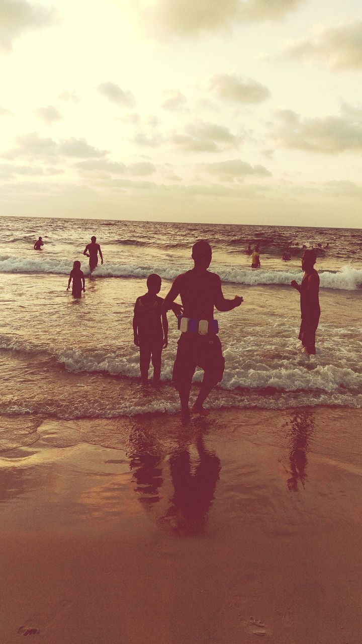 TOURISTS ENJOYING AT BEACH