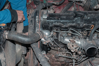 Midsection of man working in factory