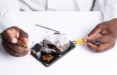 Close-up of man working over white background