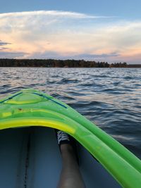 Low section of woman sitting in kayak