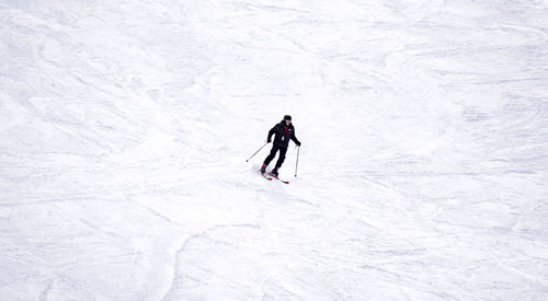 High angle view of person skiing on snow covered mountain