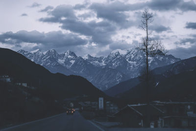 View of snow covered mountain against cloudy sky