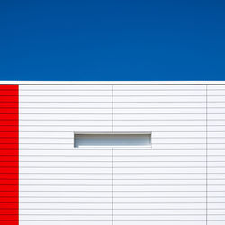 Low angle view of building against blue sky