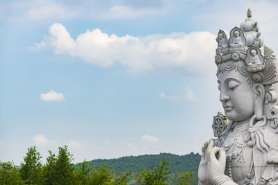 Low angle view of statue against sky