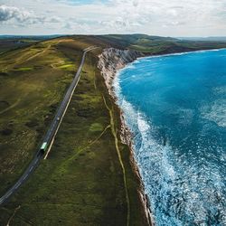 High angle view of land and sea against sky