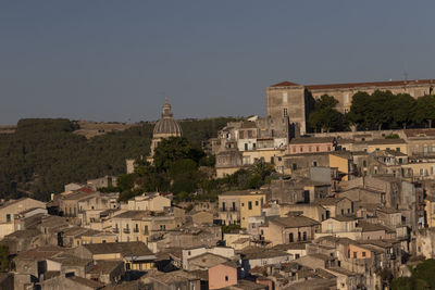 Buildings in ragusa city against clear sky