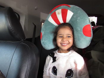 Portrait of happy girl in car