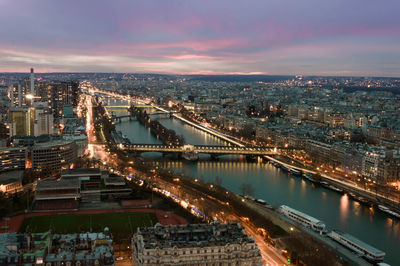 High angle view of illuminated bridge over river against sky