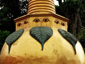 Low angle view of statue against trees