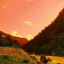 Scenic view of mountains at sunset