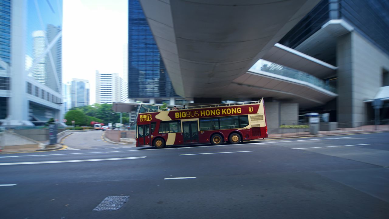 architecture, building exterior, built structure, city, transportation, street, road, text, land vehicle, day, outdoors, no people, fire engine