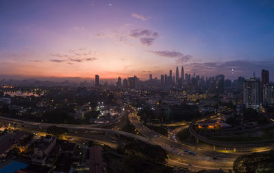 High angle view of city buildings during sunset