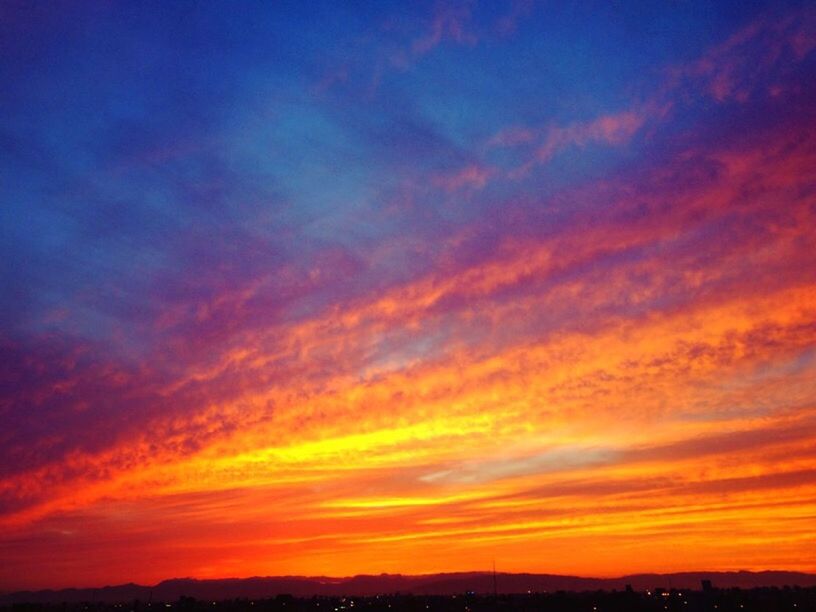 sunset, orange color, silhouette, scenics, sky, beauty in nature, tranquil scene, tranquility, dramatic sky, cloud - sky, idyllic, nature, cloud, majestic, landscape, moody sky, atmospheric mood, outdoors, awe, low angle view