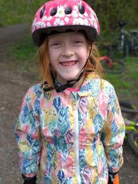 Portrait of smiling girl standing outdoors