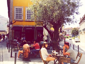 People sitting in front of building