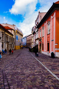 Street amidst buildings in city against sky