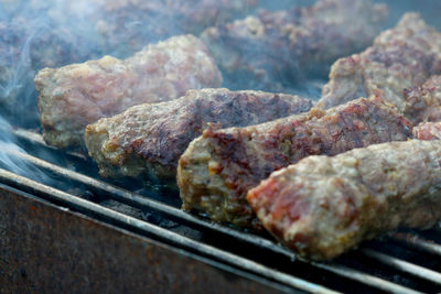 Close-up of meat on barbecue grill