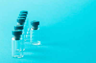 Close-up of bottle against blue background