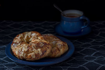 Arab donuts on a blue plate. dark mood. 