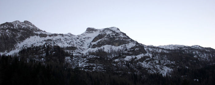 Scenic view of snowcapped mountains against clear sky