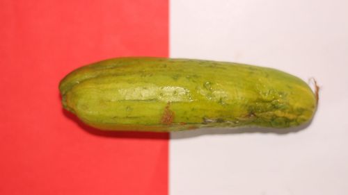 Close-up of lemon slice over white background