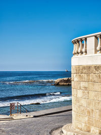 Scenic view of sea against clear blue sky